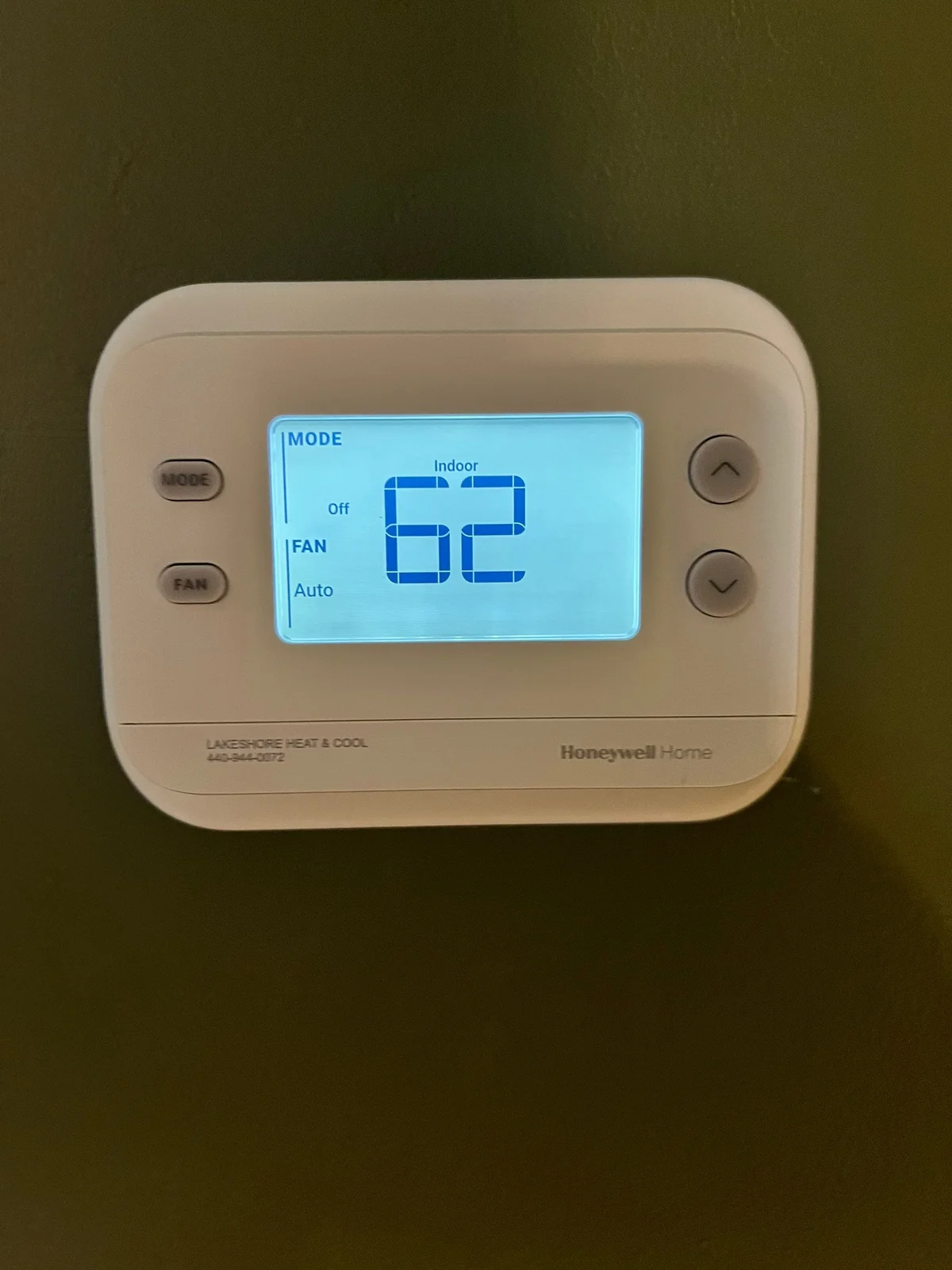 Wi-Fi enabled smart thermostat on wall